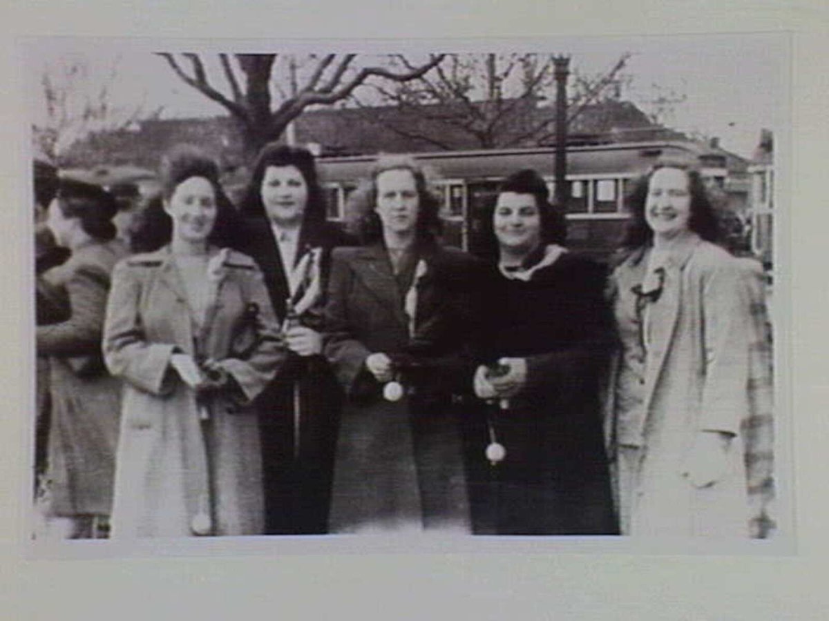 Helen and Maria Polites, Freda and Betty Gregory and Helen Fatouros on Victory Day, Melbourne, 1945