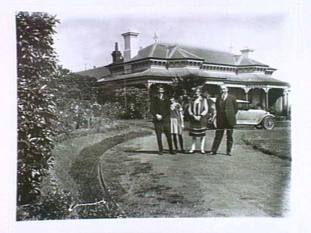 Dr. Krizos, Mrs. Krizos, Michael and Fife at their home in Auburn Road, Hawthorn. 1920s