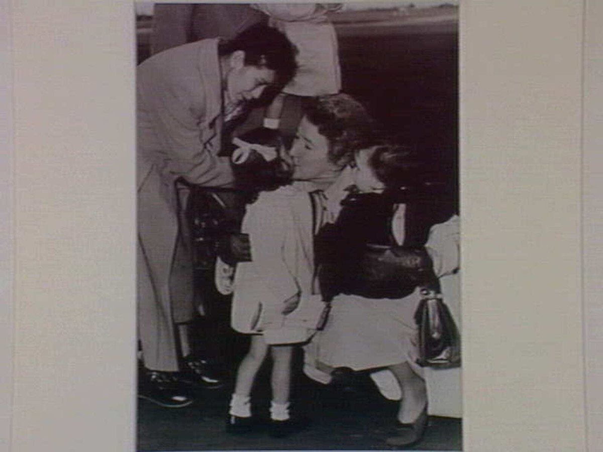 Gordon Parker's mother, Mrs. Venn Parker, greets her grandchildren at Essendon Airport July 1952, Essendon North