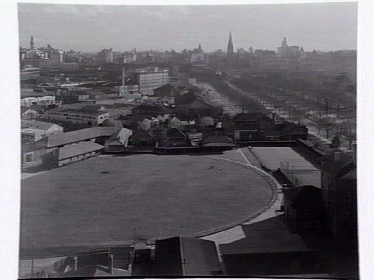 View over roof tops looking towards city along St. Kilda Road, Melbourne, shows Radio Corporation building to left, Melbourne City (c. 1943)