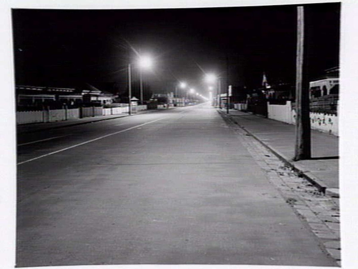 Suburban street at night, Williamstown (1949)