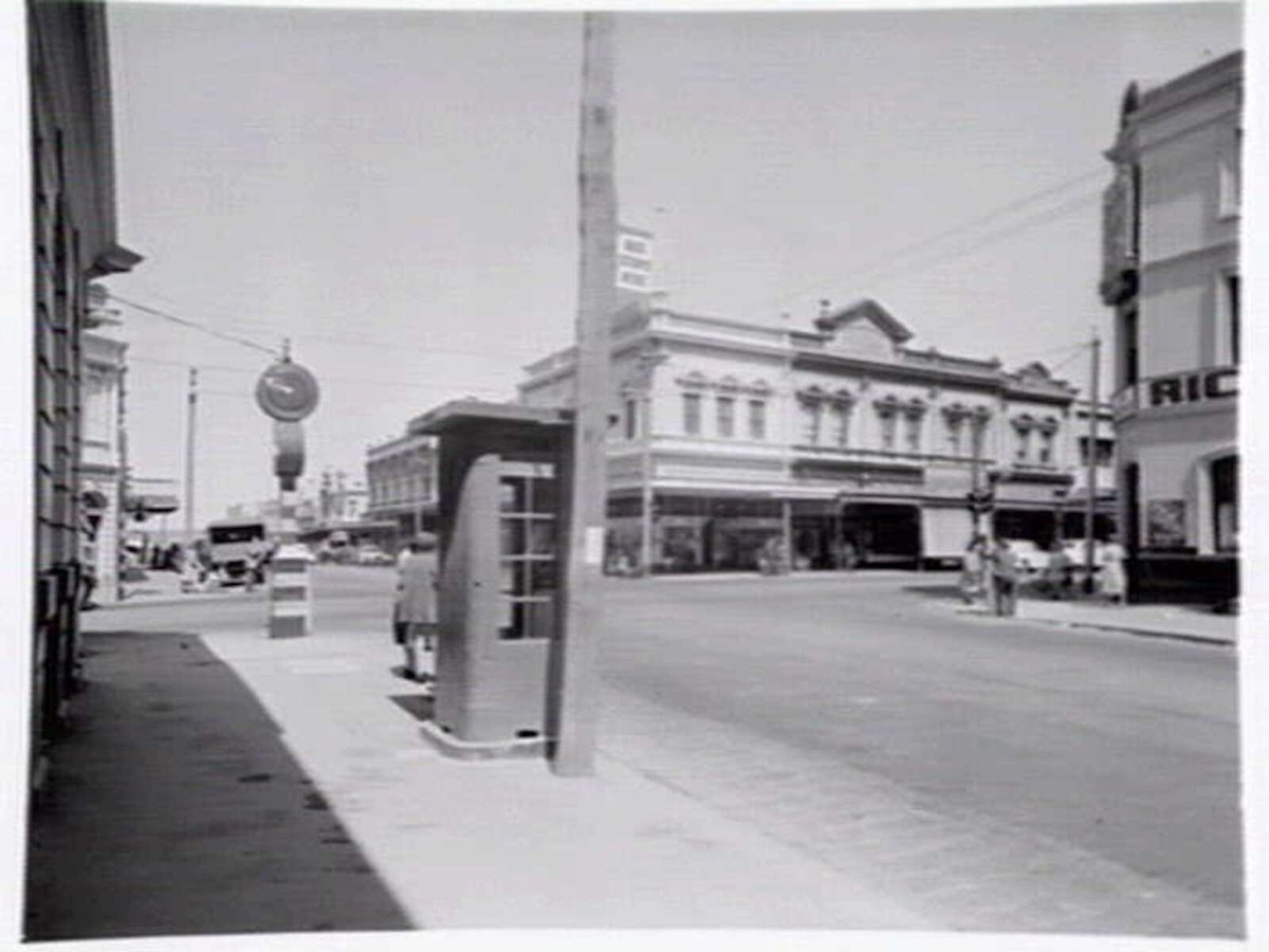 Intersection of Smith and Johnston Sts., Collingwood, telephone box in foreground (c. 1949)