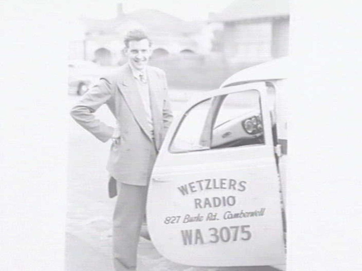 Service van for Wetzlers Radio, 827 Burke Rd., Camberwell, with a man standing at the open door of van (c. 1950)