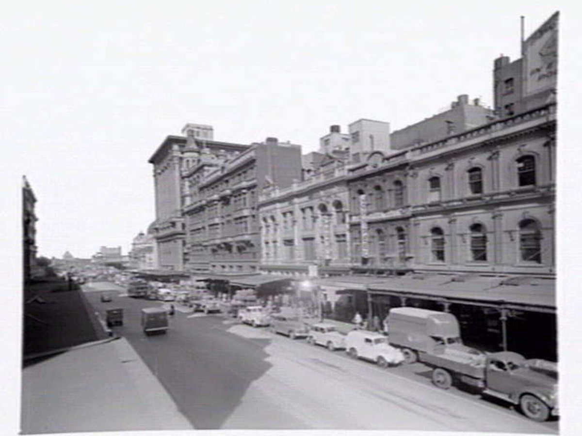 Swanston Street, west side, and Town Hall, 67 Swanston Street and John Peel Men and Boys Wear, Melbourne City (c. 1950)