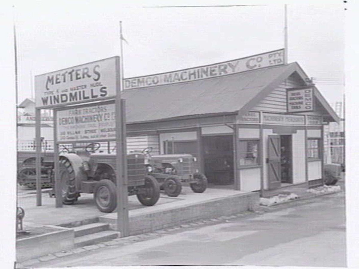Demco Machinery Co. display of tractors, possibly at 355 William Street, Melbourne, Melbourne City (c. 1951)