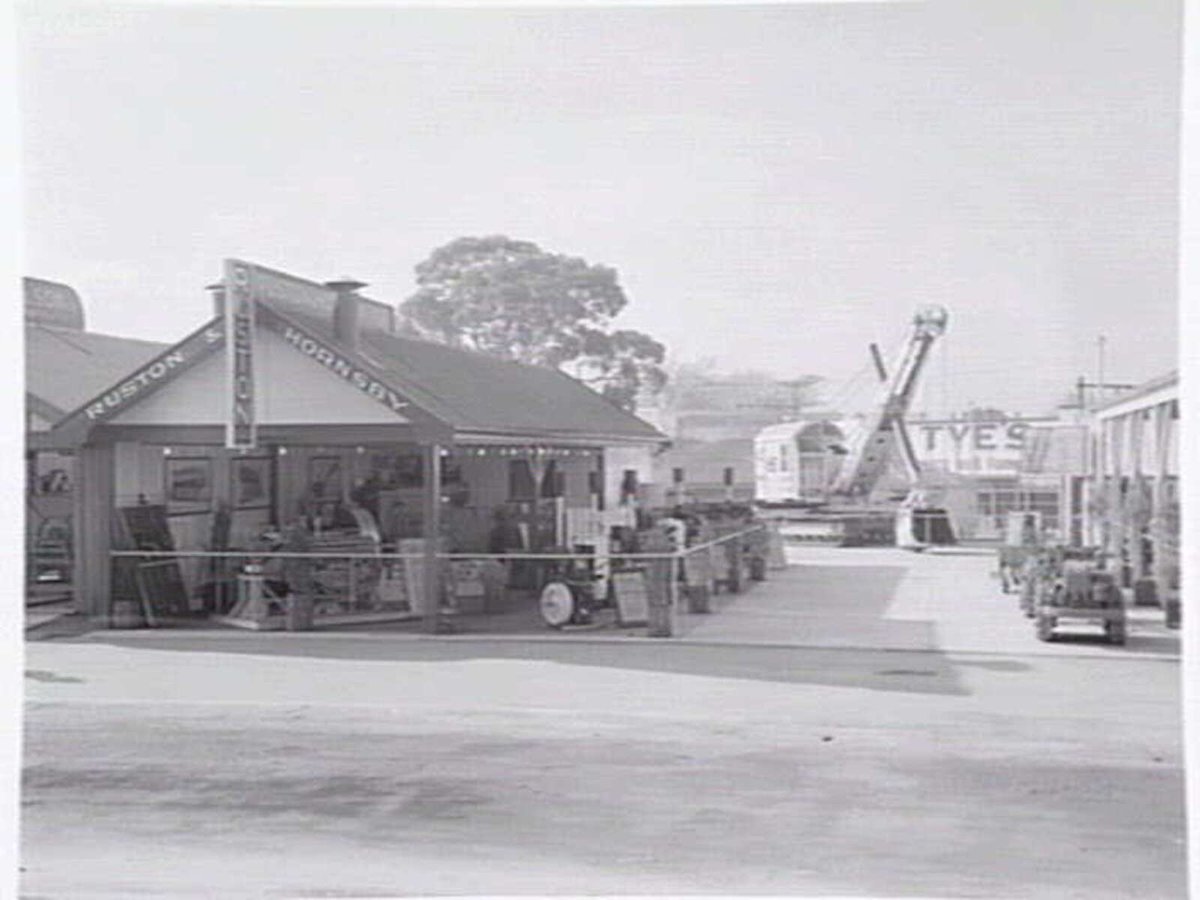 Display of tractors and farm machinery, by Ruston & Hornsby, at the Royal Melbourne Show (c. 1952)