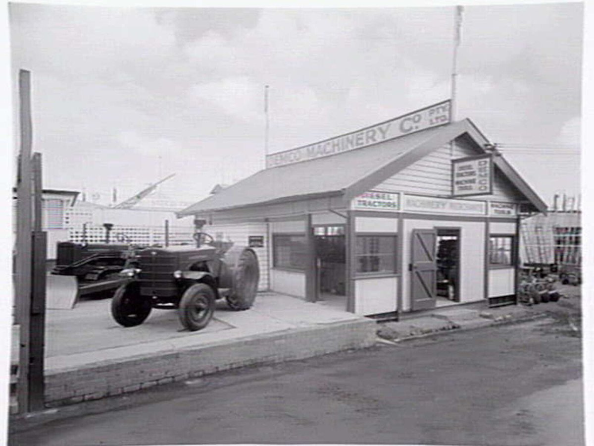 Display, Demco Machinery, tractors and farm machinery, at Royal Melbourne Showgrounds, Flemington (c. 1952)