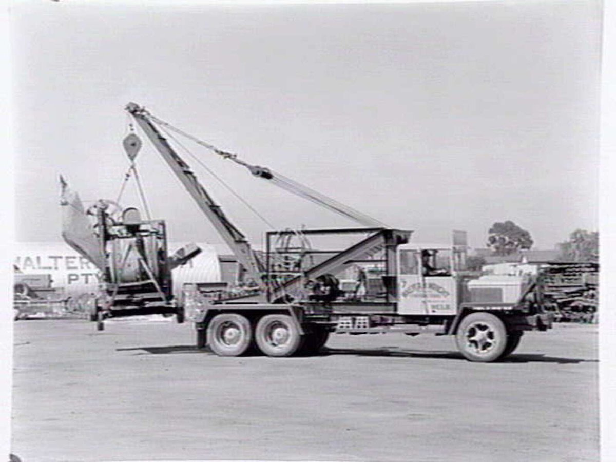 Truck, Walter H. Wright Contractors, Market St., Melbourne, with winch lifting machinery, Melbourne City (1954)