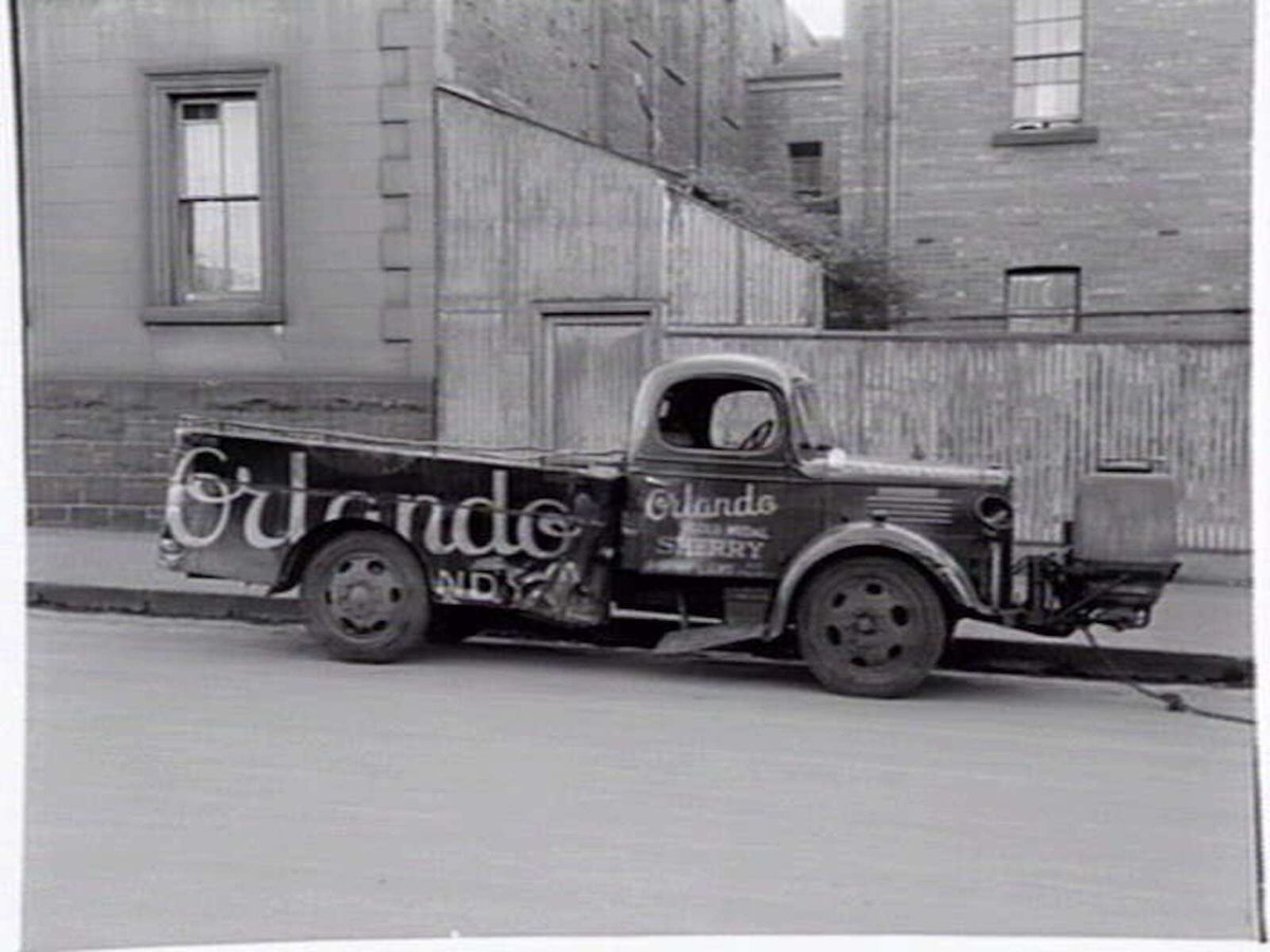 Truck belonging to G. Gramp and Sons Cellars, of 623 Collins Street, fitted with gas producer unit, Melbourne City (c. 1943)