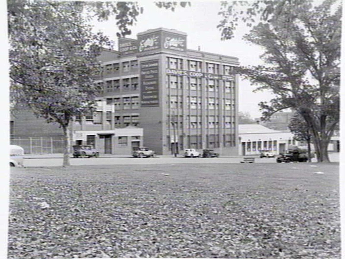 Exterior of Davies, Coop & Co., underwear manufacturers of Exacto brand, 19-31 Lincoln Square South, Carlton. Taken from Lincoln Square Gardens (1948)