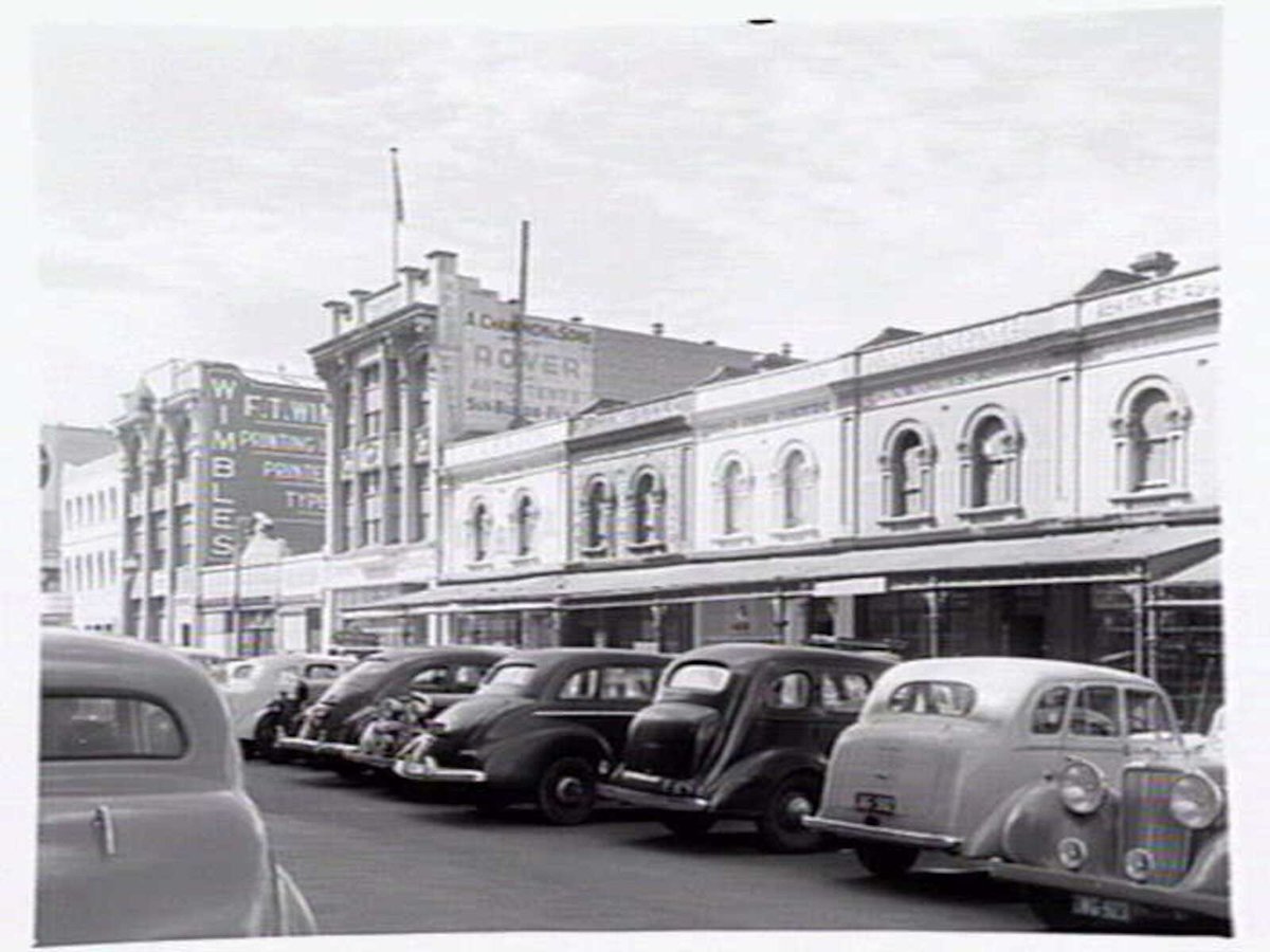Shopping strip showing small and mixed businesses at 164-172 Queen Street, Melbourne, Melbourne City (1949)