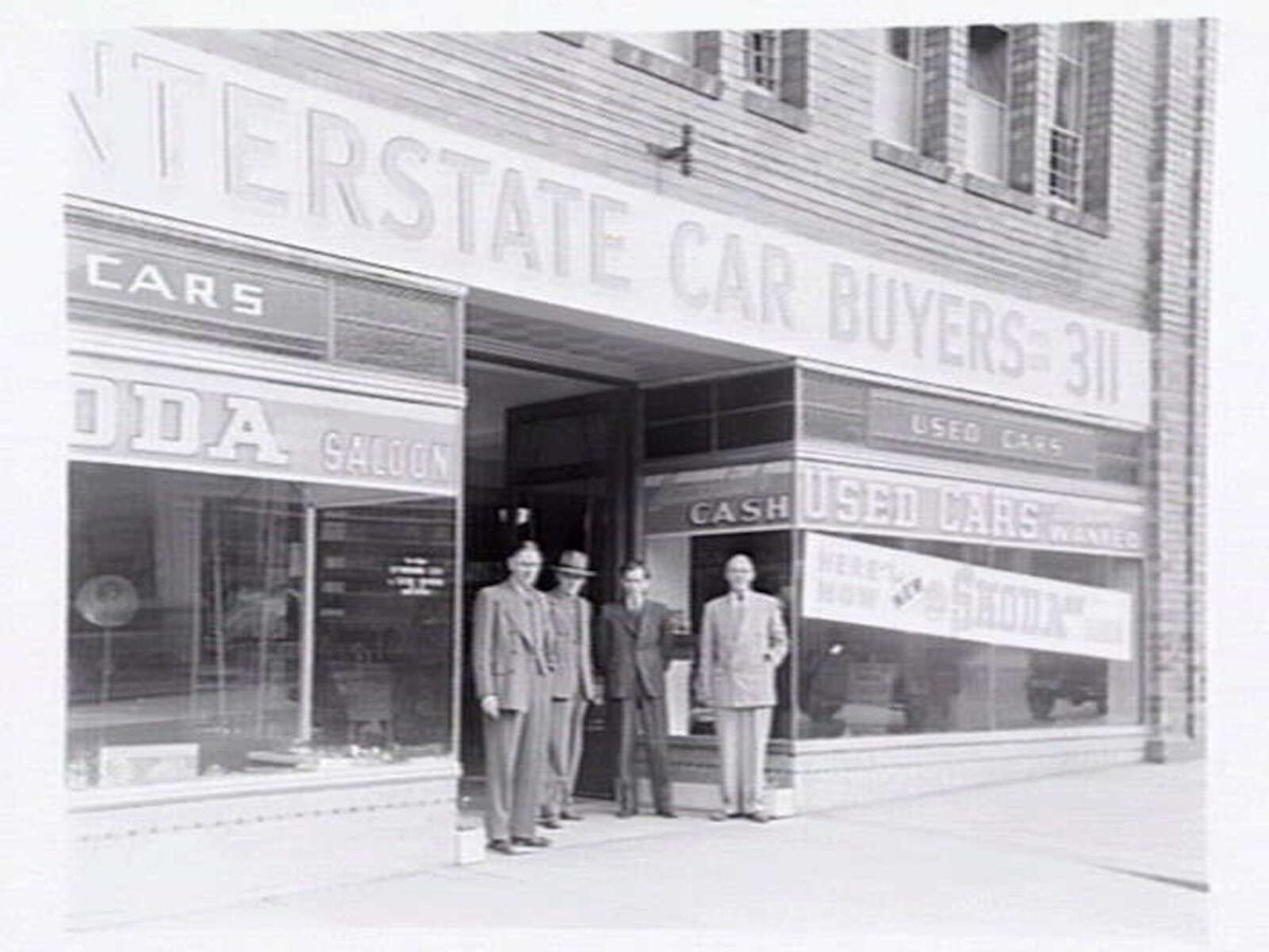 Interstate Car Buyers, 307-311 La Trobe St., Melbourne, showing exterior and Skoda car display inside, Melbourne City (1949)