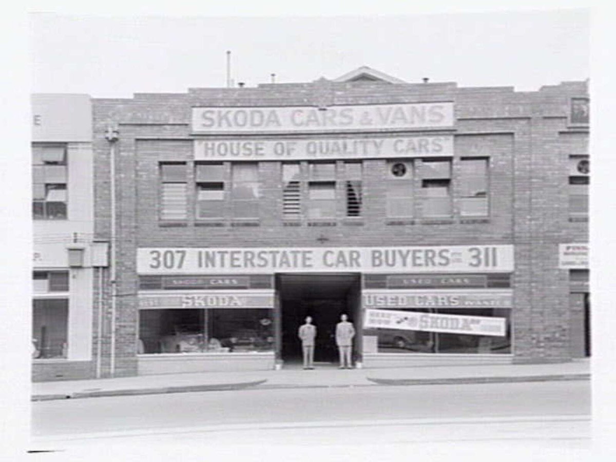 Interstate Car Buyers, 307-311 La Trobe St., Melbourne, showing exterior and Skoda car display inside, Melbourne City (1949)