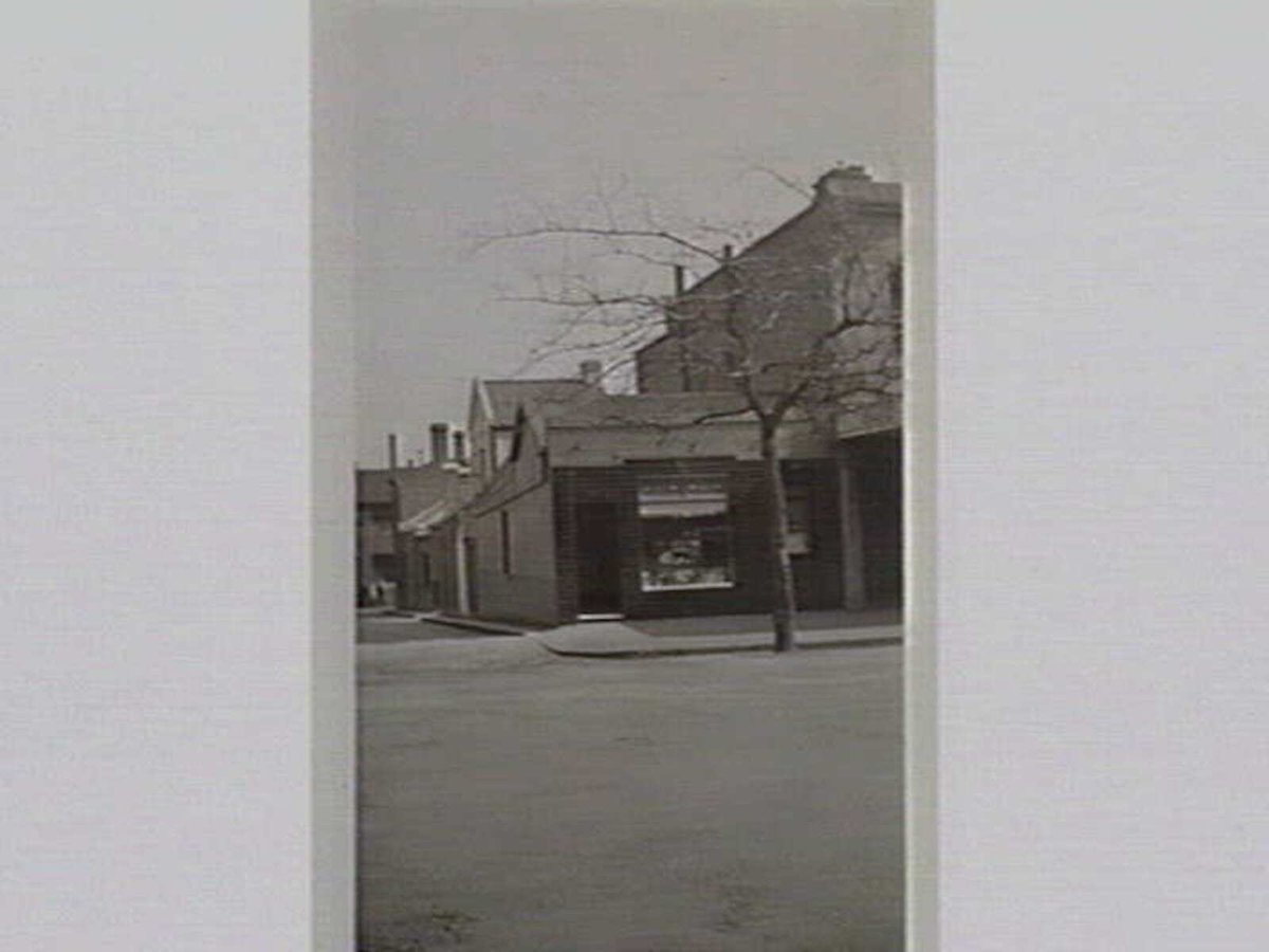 The tuck shop opposite the Model School, Spring St, Melbourne City (1933)