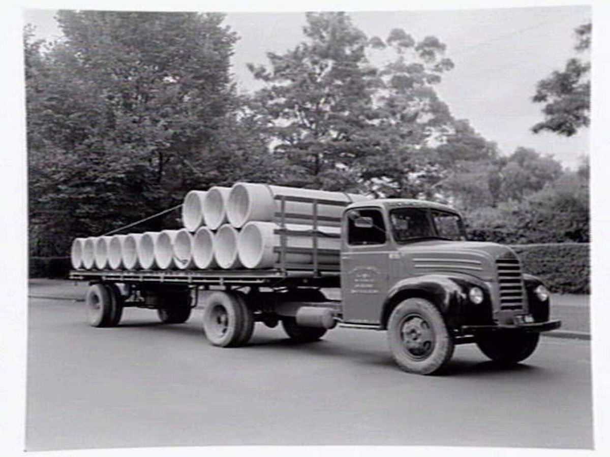 Truck from Humes Limited, 114 King Street, Melbourne, loaded with pipes, Melbourne City (1950?)