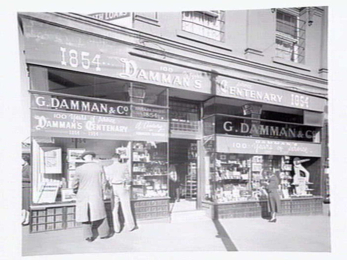 G. Damman & Co., Tobacconist, Cnr. Swanston & Collins Streets, Melbourne, Melbourne City (c. 1954)