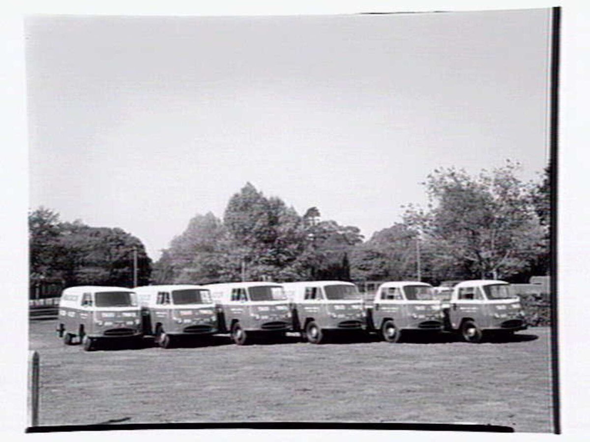 Fleet of vans from the Ambassador Hire Service, 27 Little Bourke St, Melbourne City (1938)