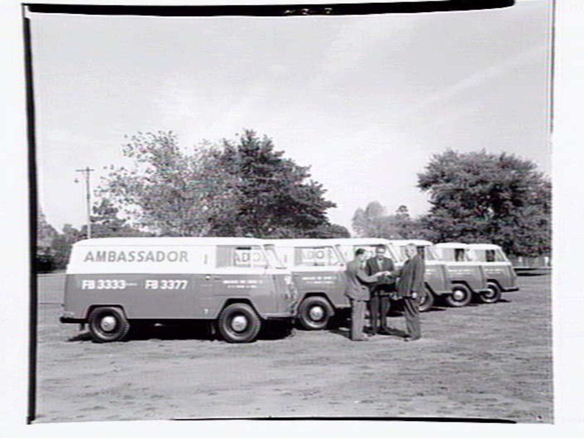 Fleet of vans from the Ambassador Hire Service, 27 Little Bourke St, Melbourne City (1938)