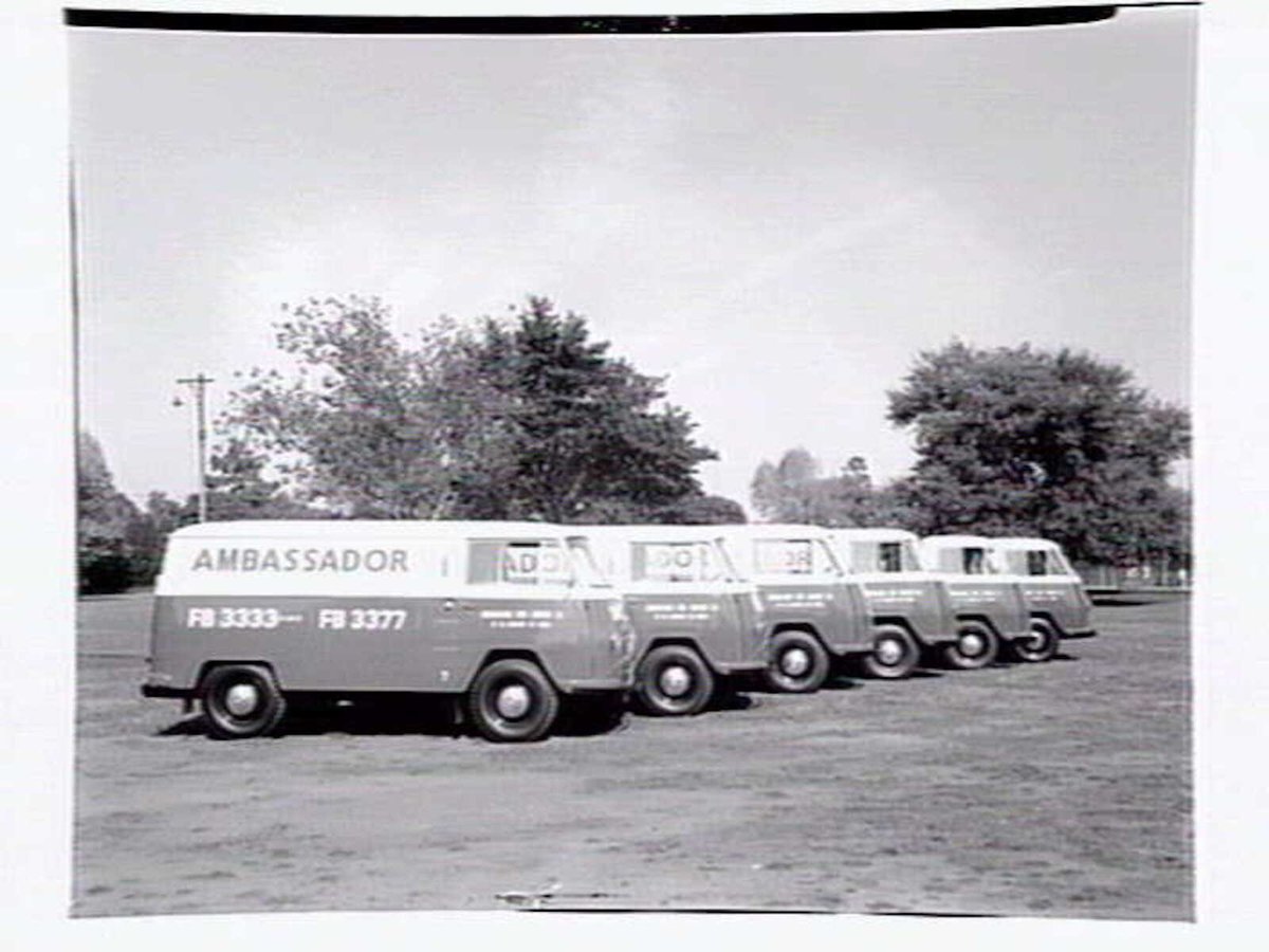Fleet of vans from the Ambassador Hire Service, 27 Little Bourke St, Melbourne City (1938)