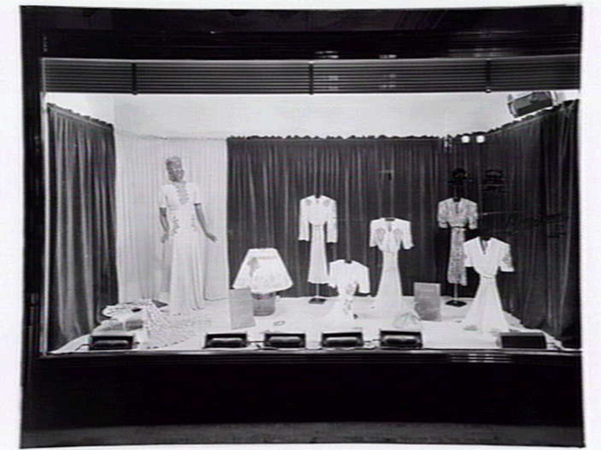 Lucy Secor Frock Salon, 280 Collins Street display window, taken during the day and at night, Melbourne City (c. 1941)