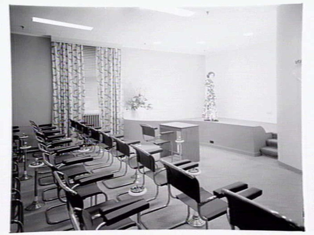 Julius Kayser & Co., 2nd floor, 328-42 Flinders Lane, Melbourne, showing small theatrette for mannequin displays, outer showroom area with display of Kayser sleeping gowns and office area, Melbourne City (1949)