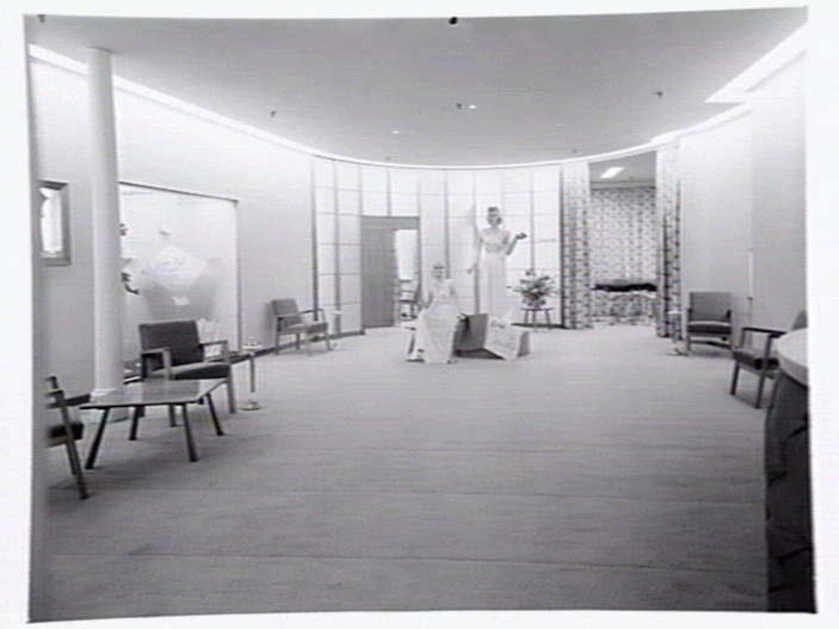 Julius Kayser & Co., 2nd floor, 328-42 Flinders Lane, Melbourne, showing small theatrette for mannequin displays, outer showroom area with display of Kayser sleeping gowns and office area, Melbourne City (1949)