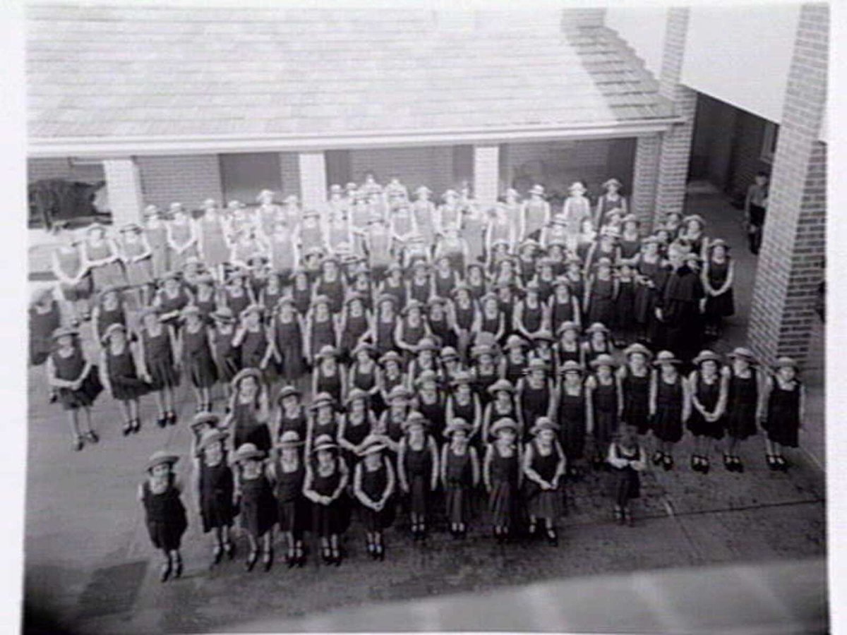 St. Vincent de Paul Girls' Orphanage, Napier St., South Melbourne, showing exterior views, girls in quadrangle and interiors of chapel, dining room and kitchen (c. 1940)