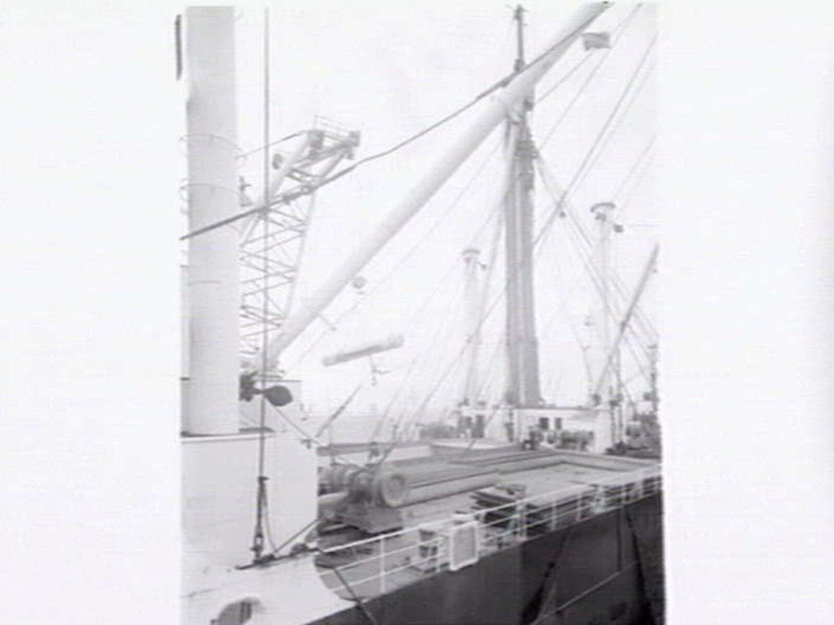 Melbourne Harbour Trust 40 ton floating crane lifting a boiler onto or from a low loader at wharf (1949)