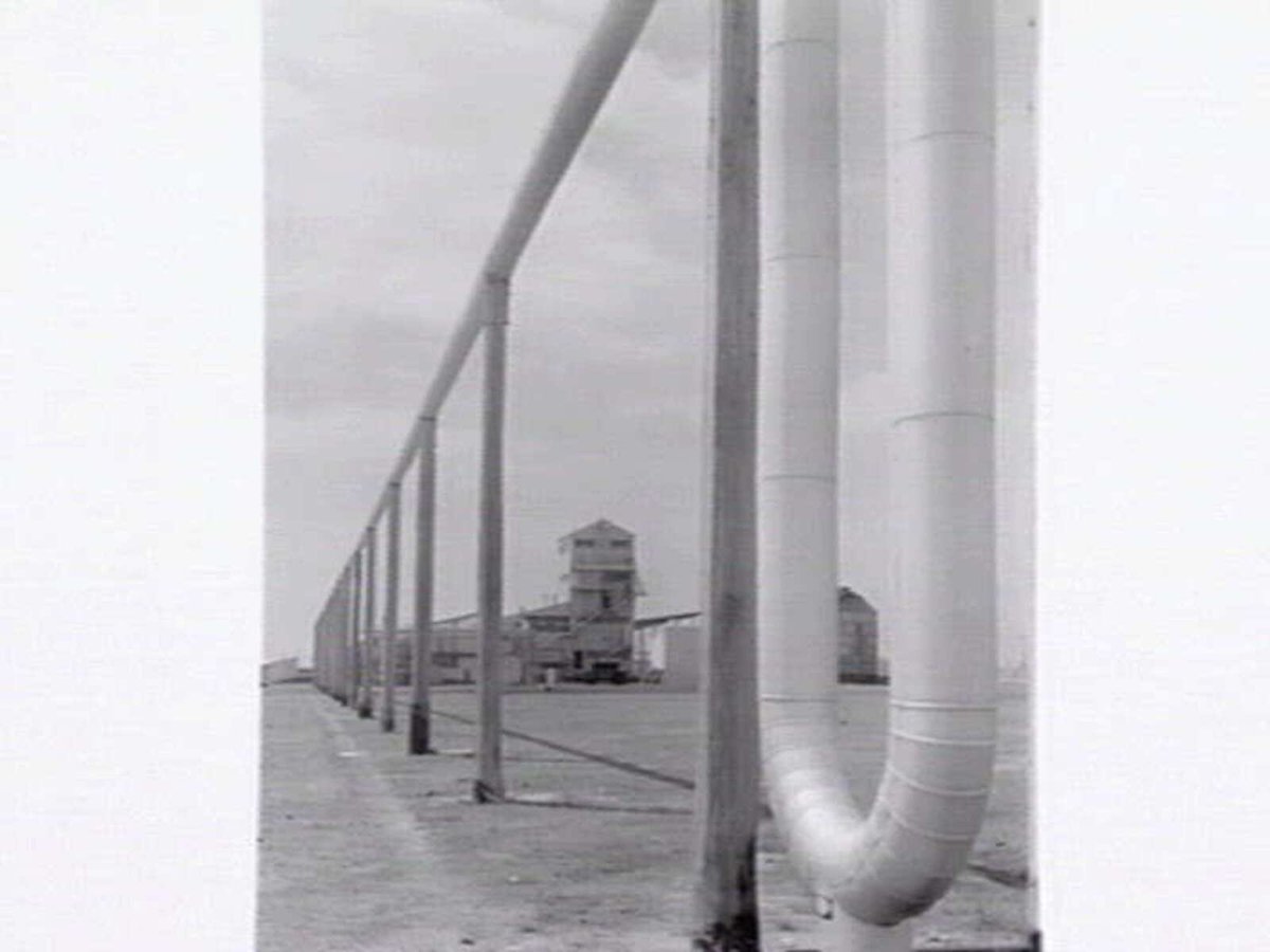 Monsanto Chemicals, Sommerville Rd., Braybrook, showing workers arriving by bus at front gate, plant and head office (1950)