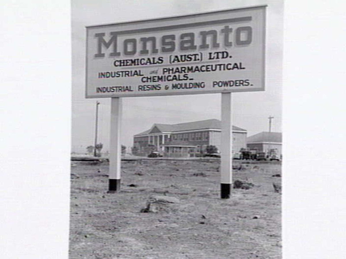 Monsanto Chemicals, Sommerville Rd., Braybrook, showing workers arriving by bus at front gate, plant and head office (1950)