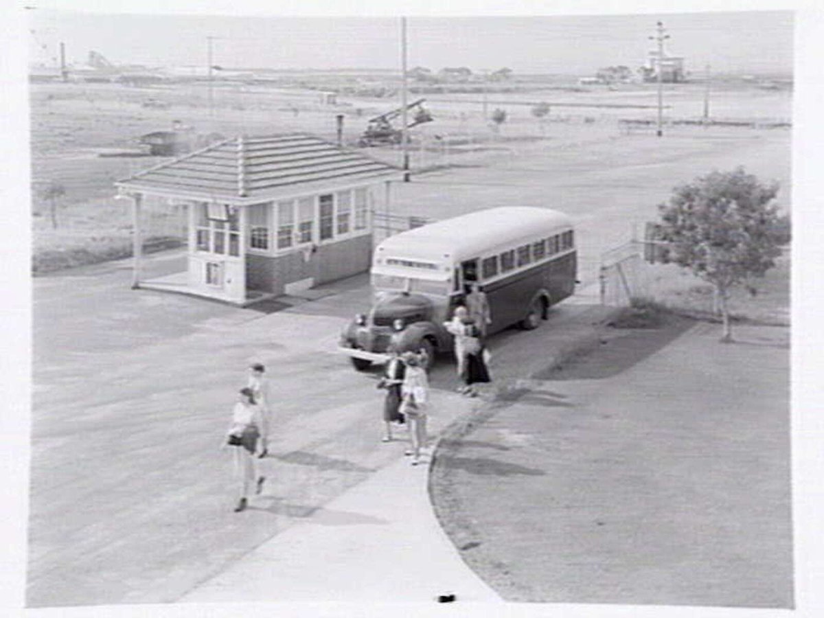 Monsanto Chemicals, Sommerville Rd., Braybrook, showing workers arriving by bus at front gate, plant and head office (1950)