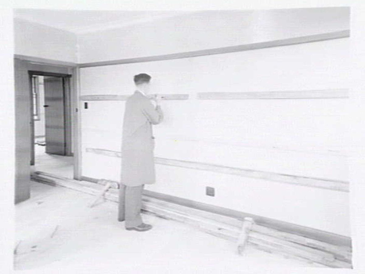 Housing Commission of Victoria pre-fabricated timber houses, showing construction in kitchen, bathroom and laundry, transfer of sections to building sites and positioning of houses on blocks at Sandringham Estate (1949)