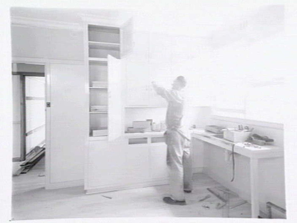 Housing Commission of Victoria pre-fabricated timber houses, showing construction in kitchen, bathroom and laundry, transfer of sections to building sites and positioning of houses on blocks at Sandringham Estate (1949)