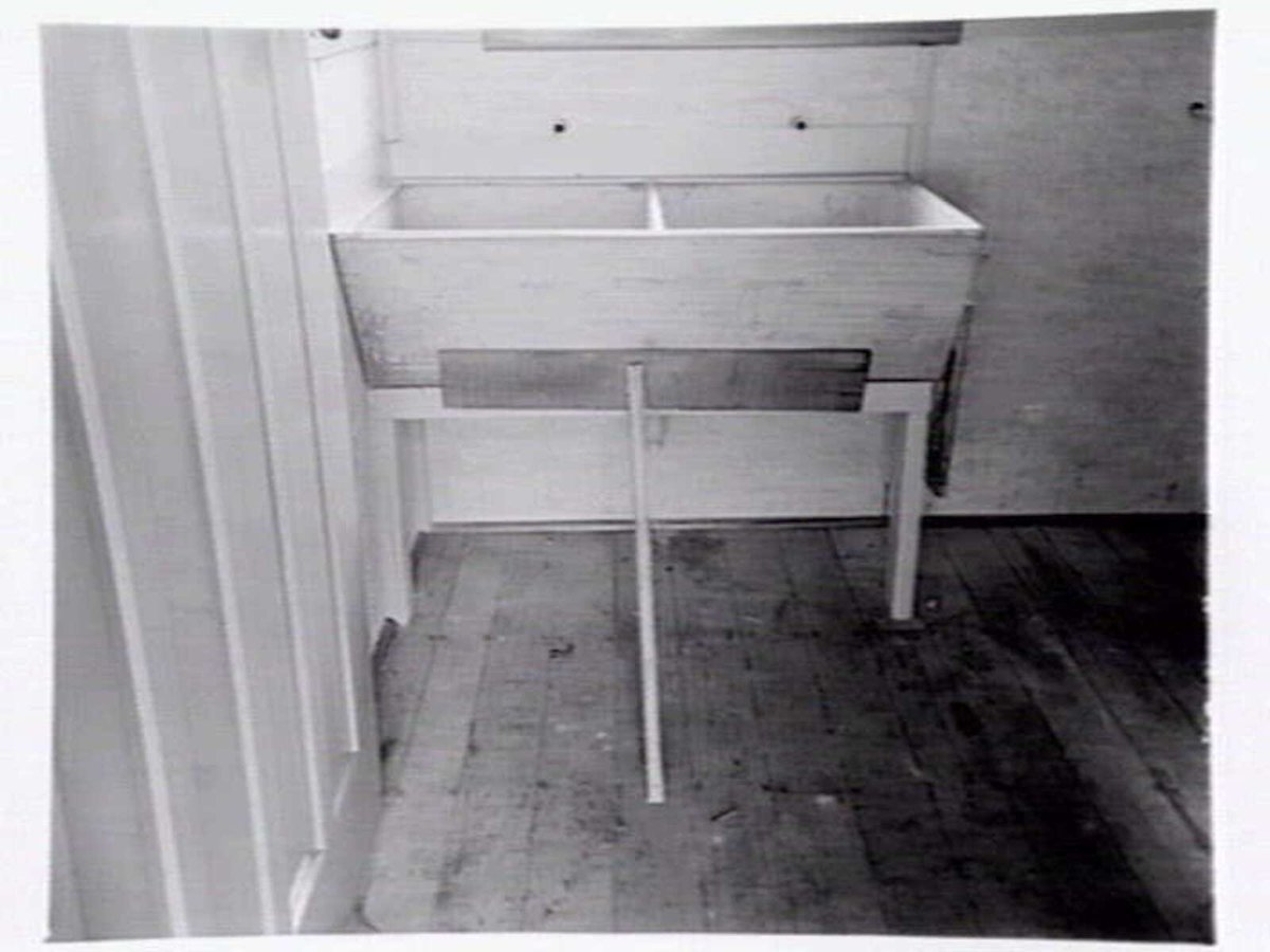 Housing Commission of Victoria pre-fabricated timber houses, showing construction in kitchen, bathroom and laundry, transfer of sections to building sites and positioning of houses on blocks at Sandringham Estate (1949)