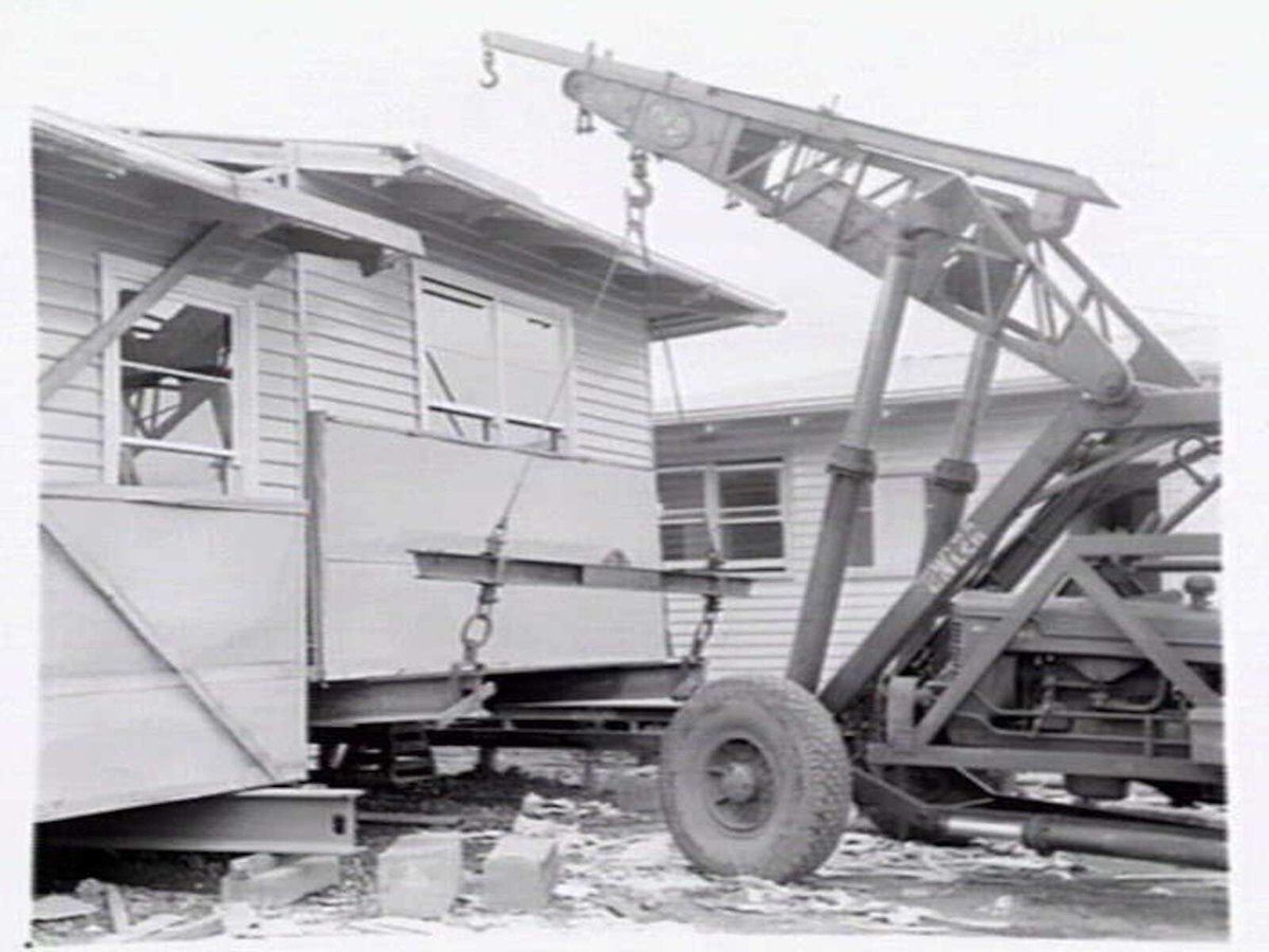 Housing Commission of Victoria pre-fabricated timber houses, showing construction in kitchen, bathroom and laundry, transfer of sections to building sites and positioning of houses on blocks at Sandringham Estate (1949)