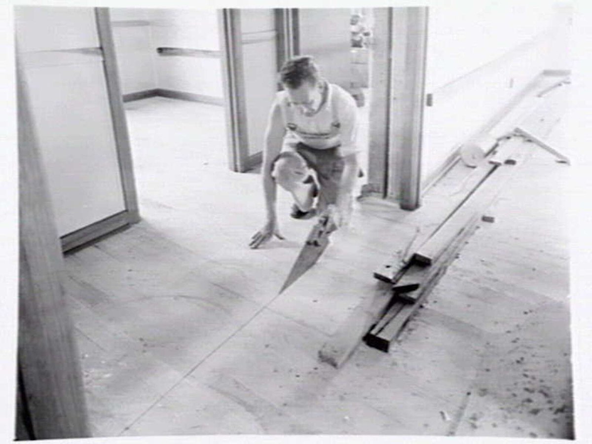 Housing Commission of Victoria pre-fabricated timber houses, showing construction in kitchen, bathroom and laundry, transfer of sections to building sites and positioning of houses on blocks at Sandringham Estate (1949)