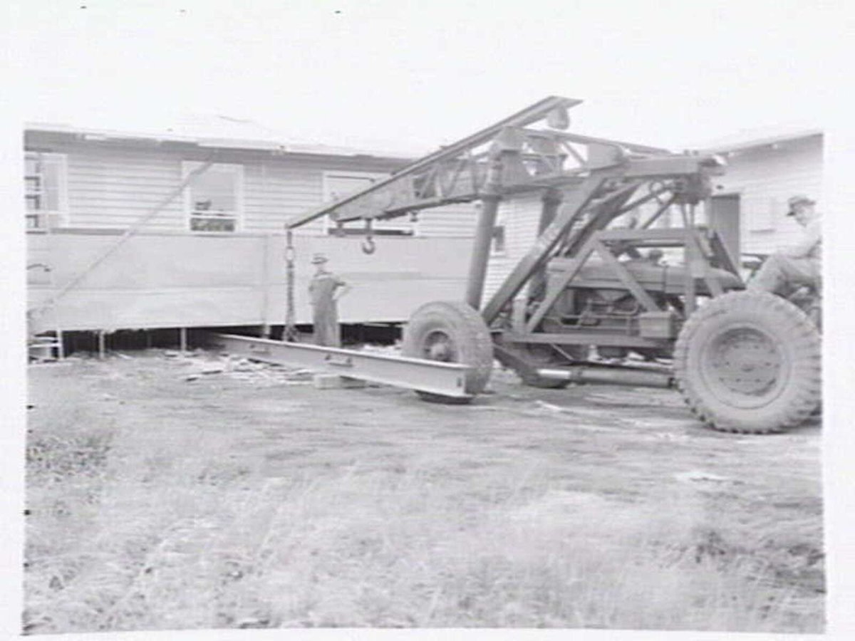 Housing Commission of Victoria pre-fabricated timber houses, showing construction in kitchen, bathroom and laundry, transfer of sections to building sites and positioning of houses on blocks at Sandringham Estate (1949)