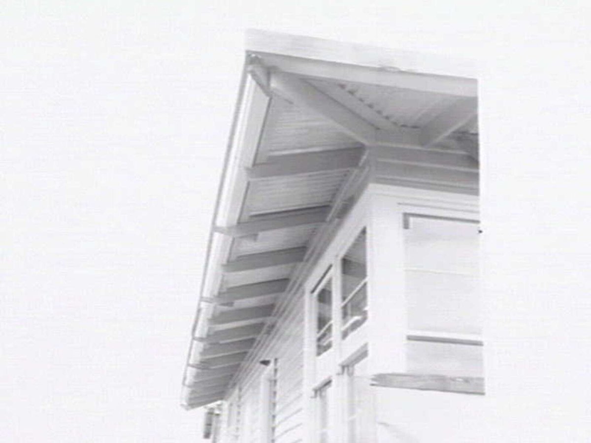 Housing Commission of Victoria pre-fabricated timber houses, showing construction in kitchen, bathroom and laundry, transfer of sections to building sites and positioning of houses on blocks at Sandringham Estate (1949)