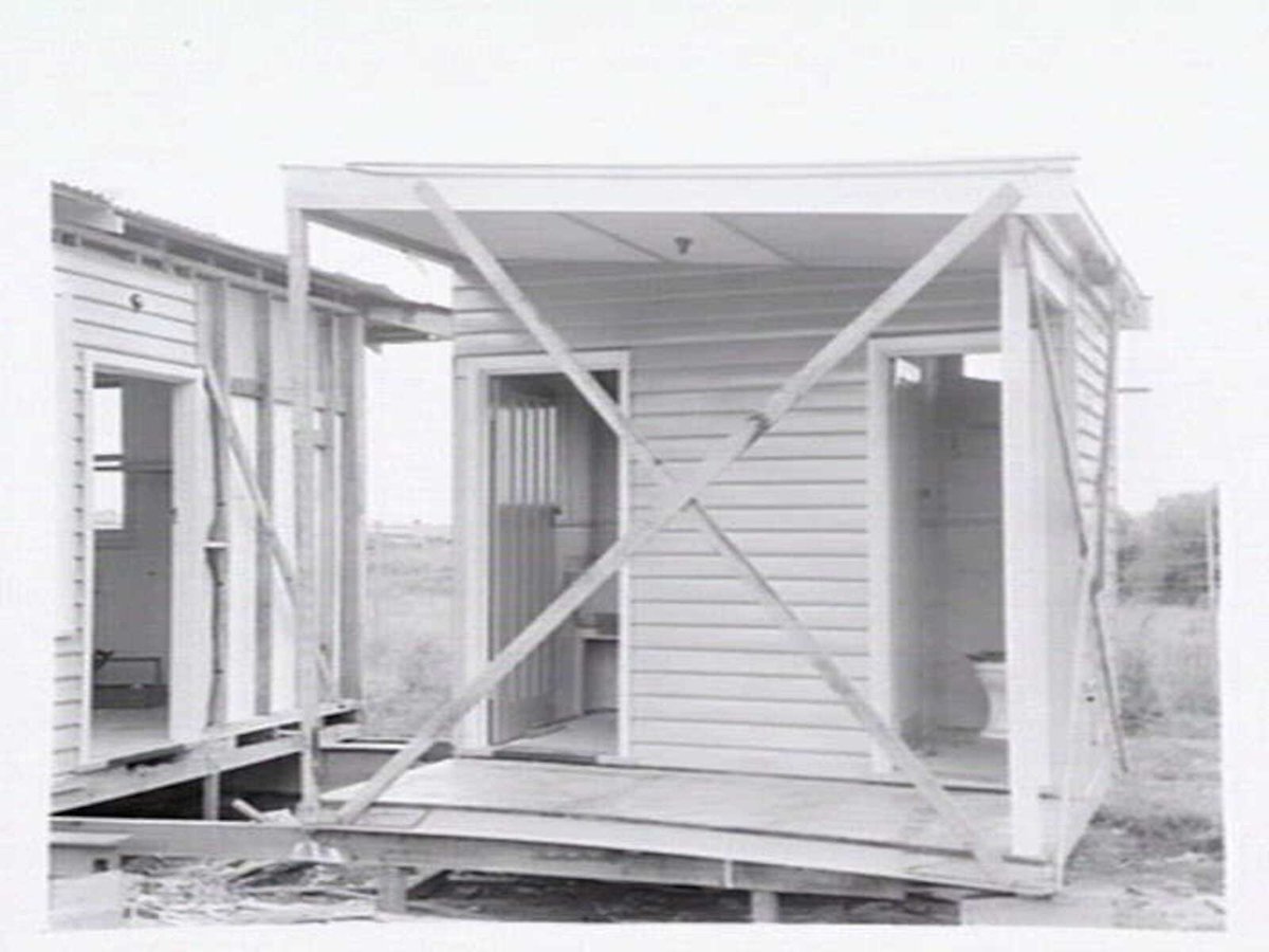 Housing Commission of Victoria pre-fabricated timber houses, showing construction in kitchen, bathroom and laundry, transfer of sections to building sites and positioning of houses on blocks at Sandringham Estate (1949)