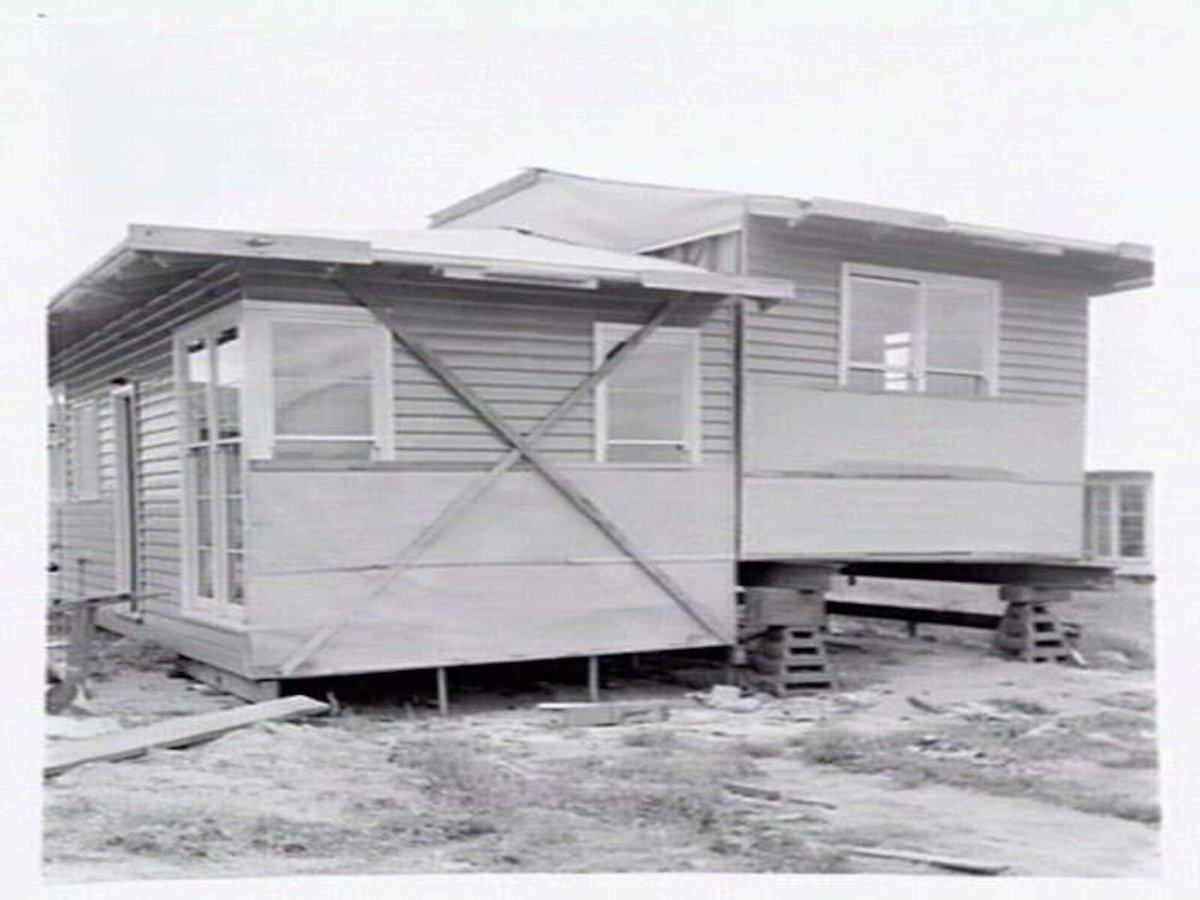 Housing Commission of Victoria pre-fabricated timber houses, showing construction in kitchen, bathroom and laundry, transfer of sections to building sites and positioning of houses on blocks at Sandringham Estate (1949)
