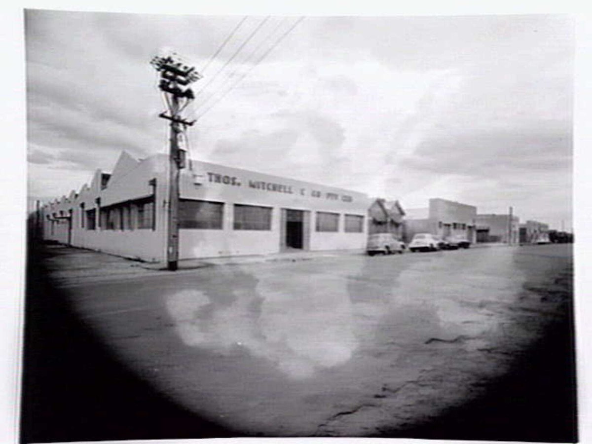 Thomas Mitchell & Son brushwear products, including broom heads, mops, straw brooms, paint brushes, feather dusters, scrubbing brushes and view of premises at 120-152 Victoria St., Brunswick (1952)