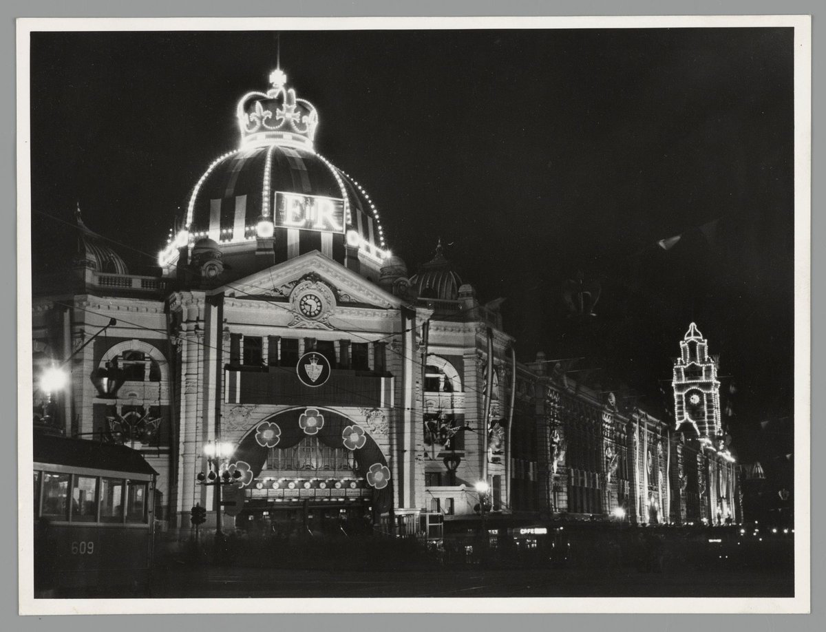 Flinders Street Railway Station (Swanston Street entrance), illuminated for Royal Visit, Melbourne City (1954)