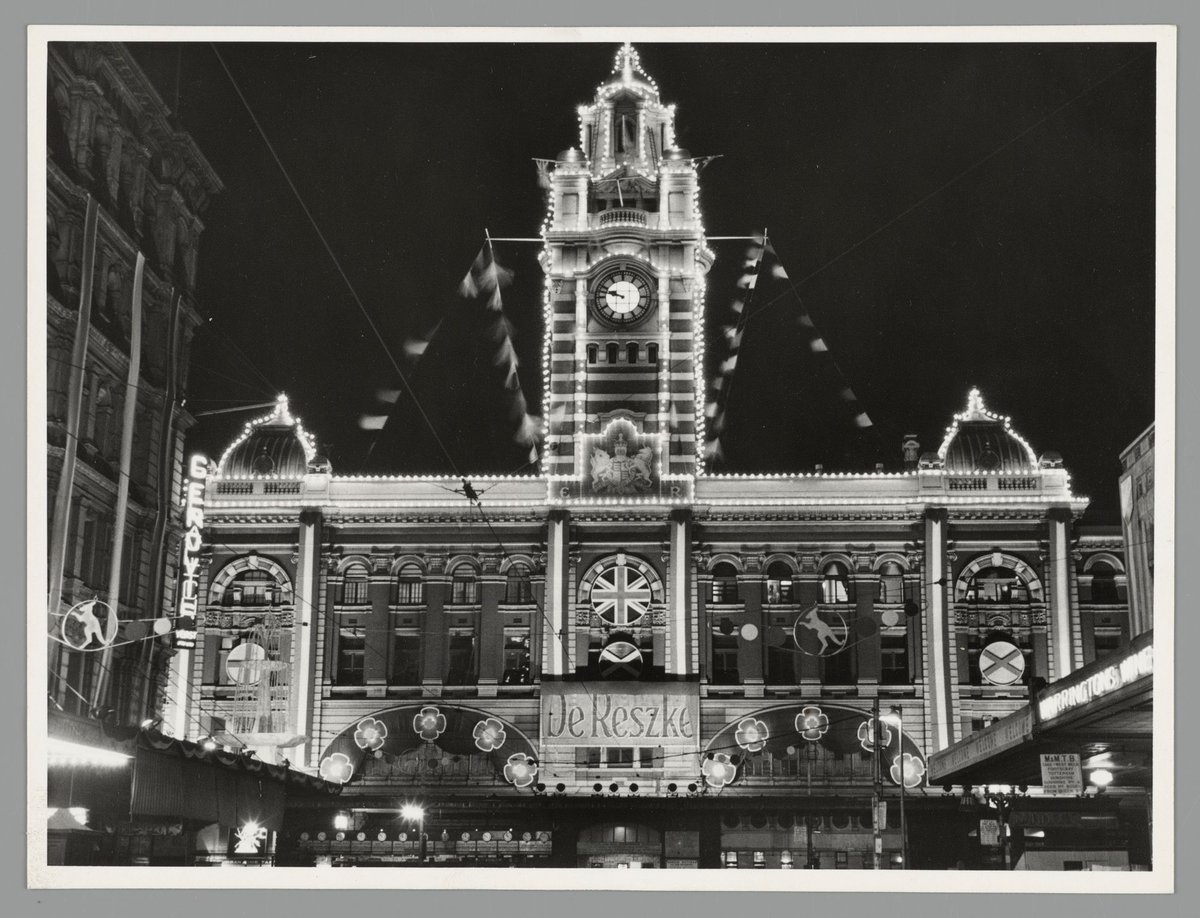 Flinders Street Railway Station (Elizabeth Street entrance), illuminated for Royal Visit, Melbourne City (1954)