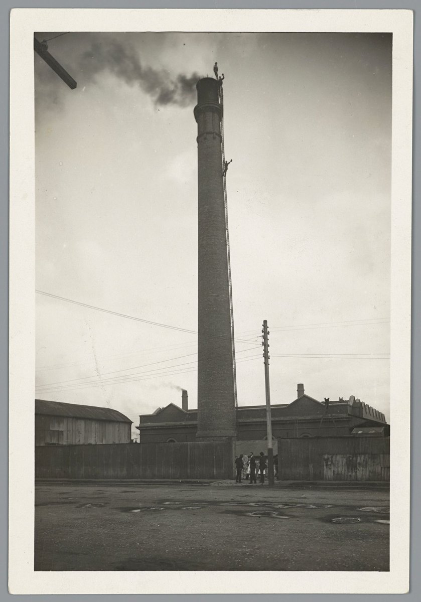 Steeplejacks repairing lightning conductors on chimney stack at Spencer Street Melbourne Railways, Melbourne City (1917)