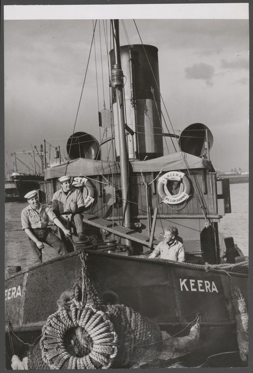 Three men standing on the tugboat Keera, Melbourne (1945)