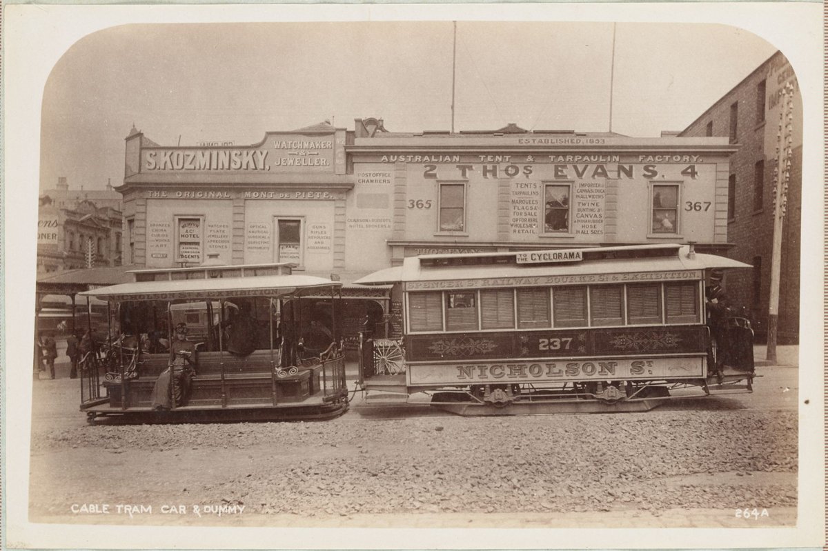 Cable tram car and dummy [in Bourke Street, showing building of S. Kozminsky], Melbourne City (1892–1900)