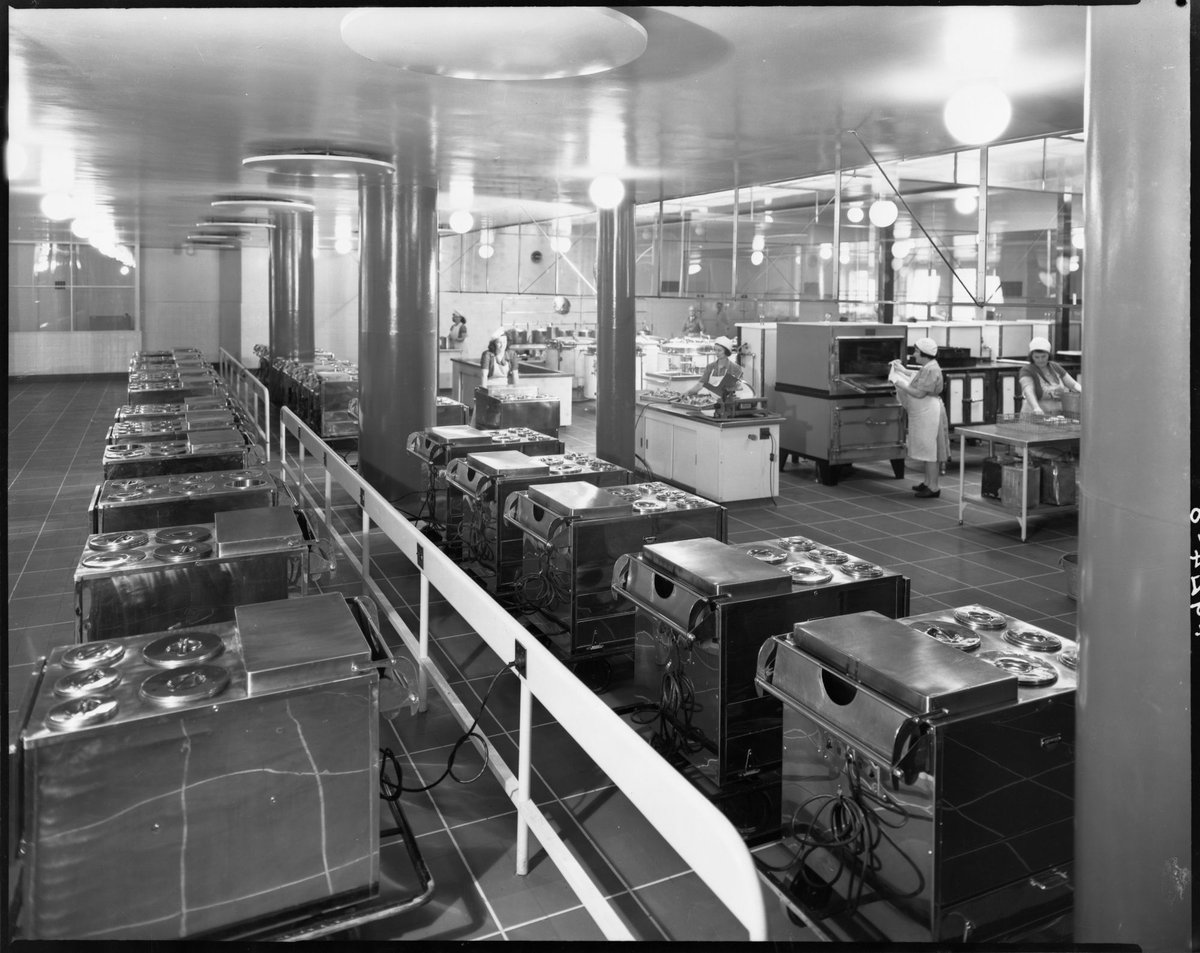 Interior view of commercial kitchen with people preparing food, Royal Melbourne Hospital, Melbourne City (1945)