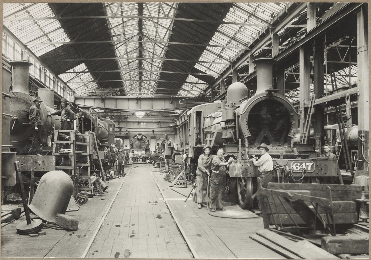 Newport Shops. [Interior, men working on engine.] (1928)