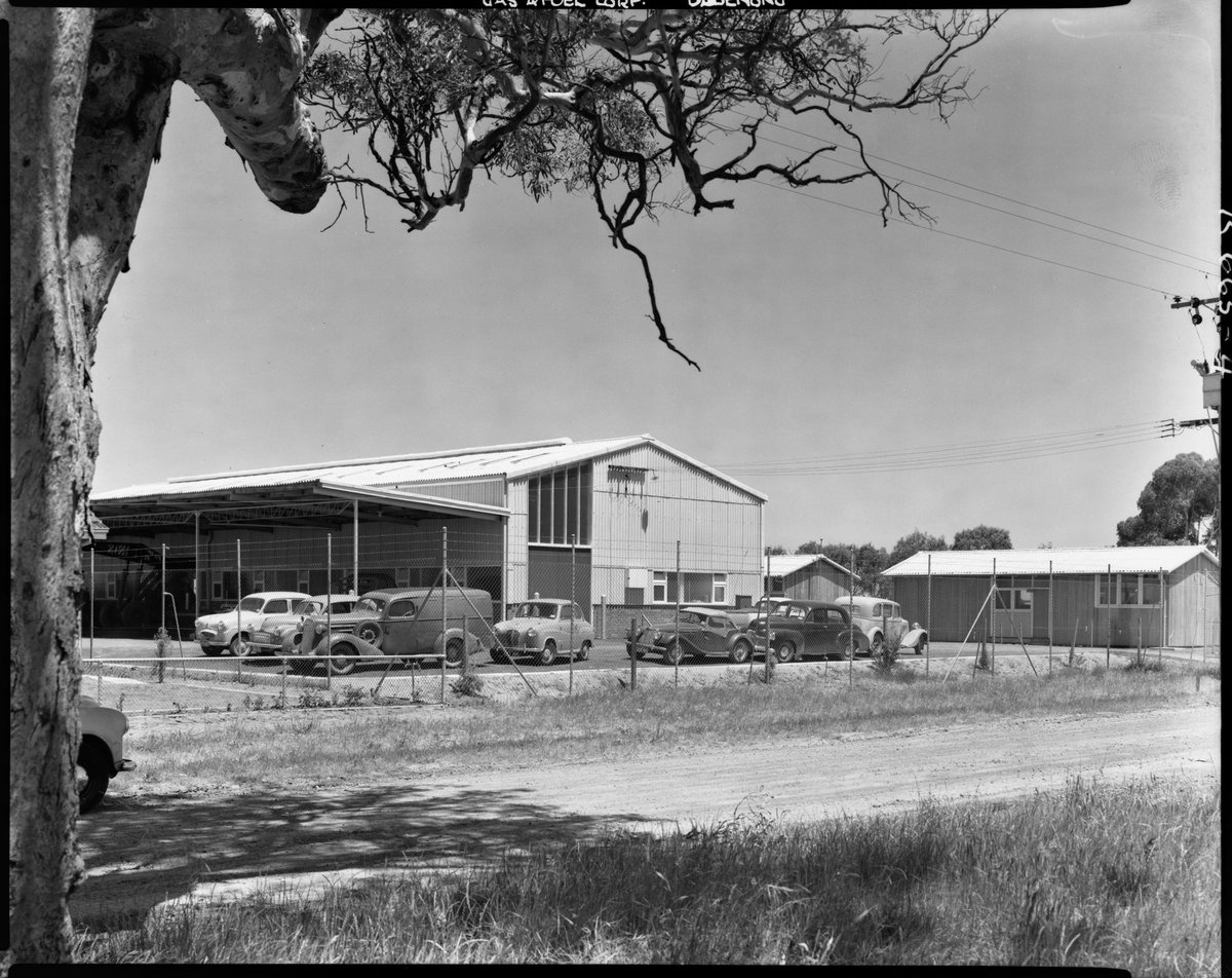 Vehicles parked outside Gas and Fuel Corporation, Dandenong (1954)