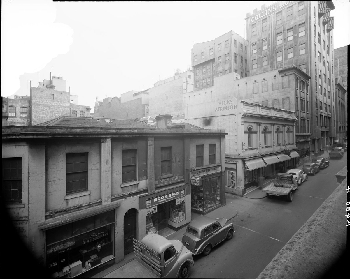 Traffic and buildings, Little Collins Street, South side between Queen and Elizabeth Streets, Melbourne City (c. 1952)